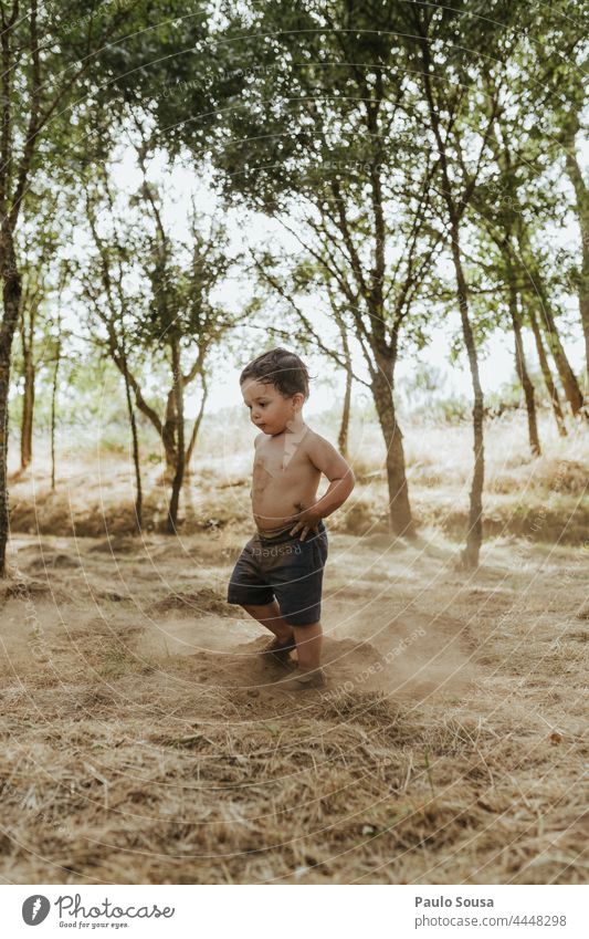 Child playing with soil childhood Summer 1 - 3 years Caucasian Lifestyle Colour photo Leisure and hobbies Infancy Multicoloured Happiness Human being Day