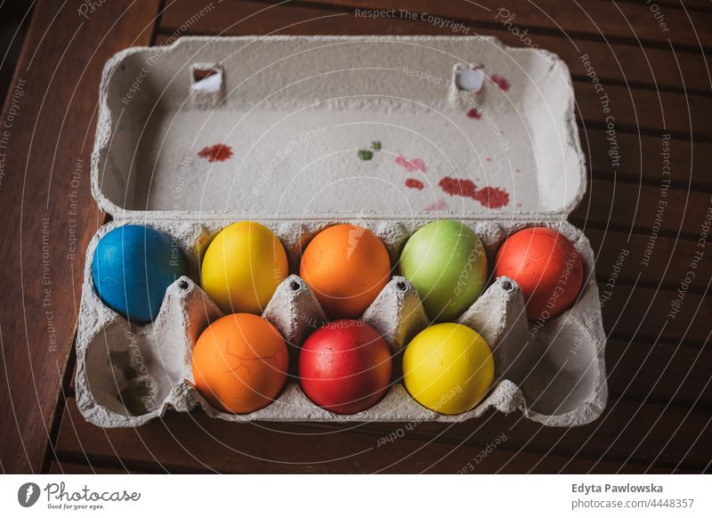 Tray with colored easter eggs organic fresh box container eggshell food fragile celebrating celebration holiday tradition decorations decorated painted