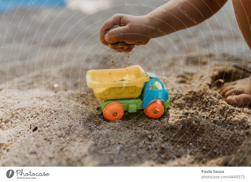 Close up child playing with sand Close-up Sand Child Structures and shapes Exterior shot Grain of sand Nature Pattern Day Detail concept Construction site Build