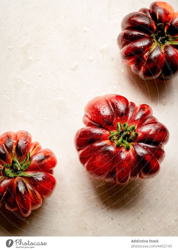 Closeup of several red tomatoes raw fresh vegetable ripe background food closeup vegetarian ingredient organic healthy group natural nature diet color