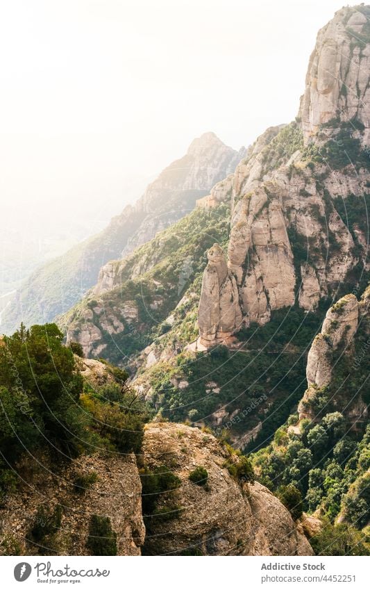 Rocky range with steep slopes in mountainous terrain peak highland landscape rock environment nature ridge top wild altitude rocky scenery plant geology