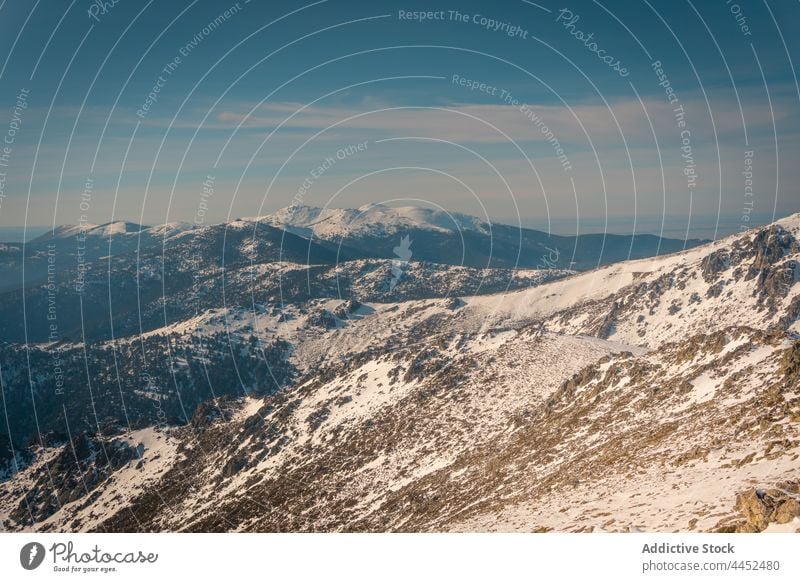 Snowy mountains under cloudy sky in daytime peak nature snow highland scenery landscape picturesque environment ridge sierra de guadarrama spain spectacular