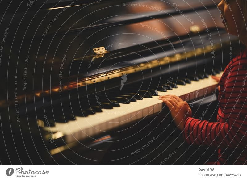 Child at the piano - the joy of music Piano Music Musical instrument Joy fun fumble Fingers Make music Playing Musician Culture Practice