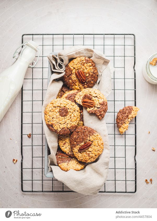 Walnut cookies and bottle of milk on table walnut dessert sweet treat tasty food homemade glass yummy drink delicious baked snack pastry biscuit beverage fresh