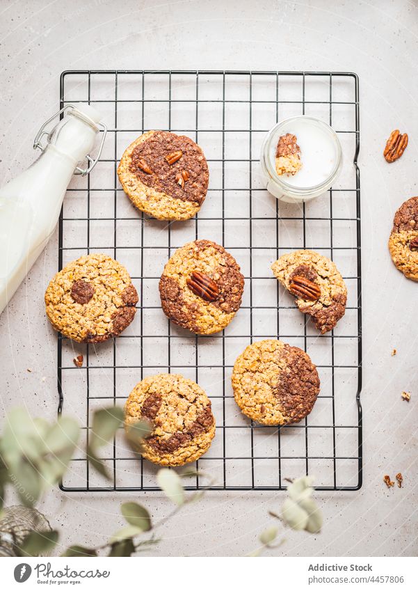 Walnut cookies and bottle of milk on table walnut dessert sweet treat tasty food homemade glass yummy drink delicious baked snack pastry biscuit beverage fresh