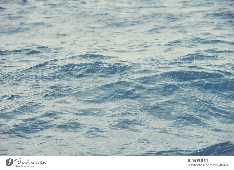 Detail of a sunlight reflecting in glittering sea. sparkler in water - background. sea water with sun glare and ripple. Powerful and peaceful nature concept.