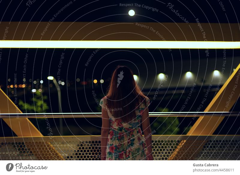 Woman from behind looking at night, the lights of the city and the moon. Night Night shot Moon Light and shadow Night sky Exterior shot Dark Moonlight