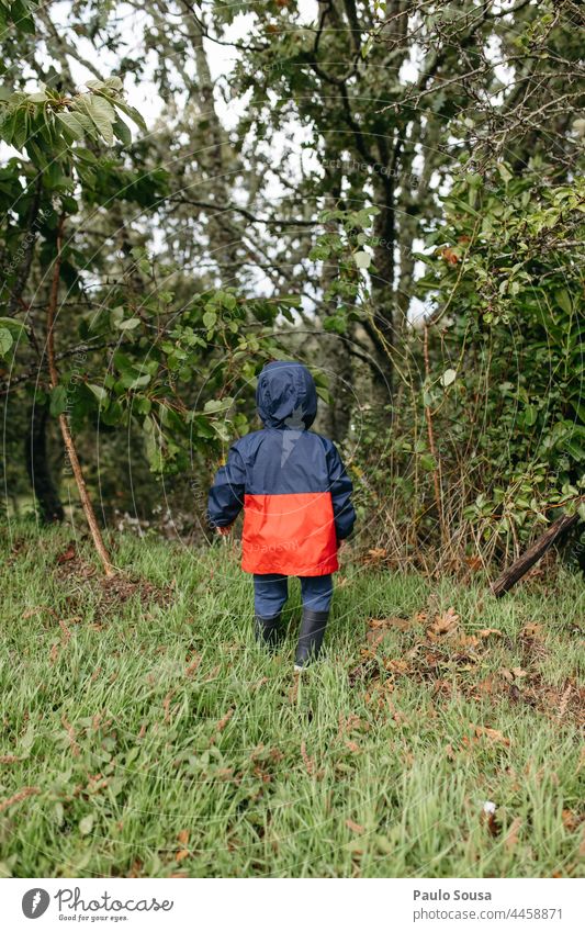 Rear view child with warm clothes Child childhood Colour photo Autumn Authentic Environment Infancy Leisure and hobbies Lifestyle Day Human being Joy Playing