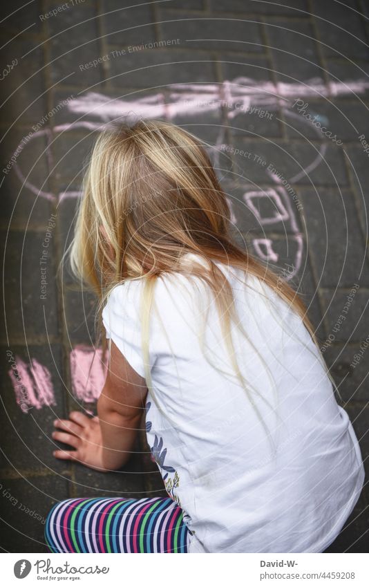 Child drawing with chalk on the street Chalk Painting (action, artwork) Street Creativity Infancy Street painting Leisure and hobbies Playing fun Girl