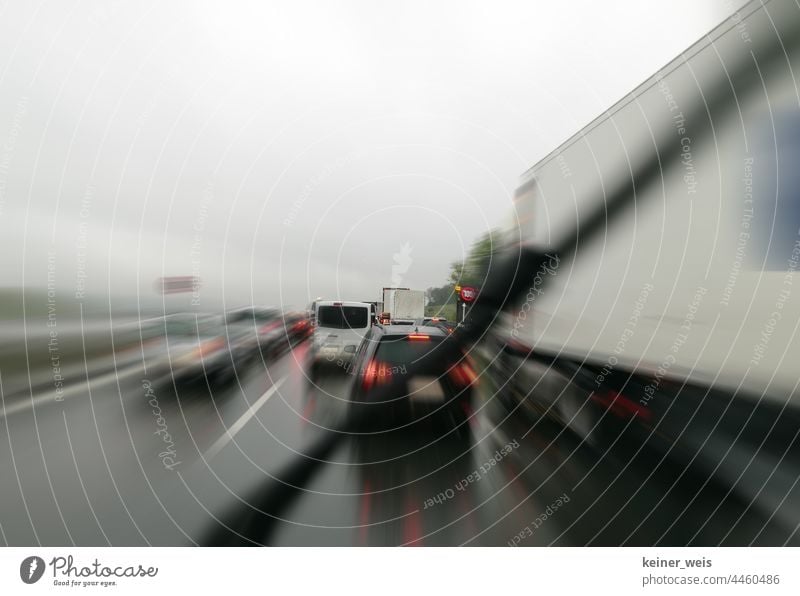 Where is the emergency lane in the traffic jam before the construction site on the motorway? rescue alley Highway Construction site cars Speed limit Traffic jam