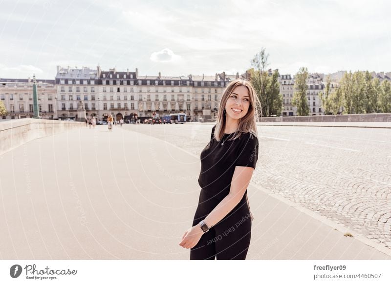 Young tourist on the streets of Paris woman France tourism travel hiking sports clothing walking city urban copy space Building antique contemplating young