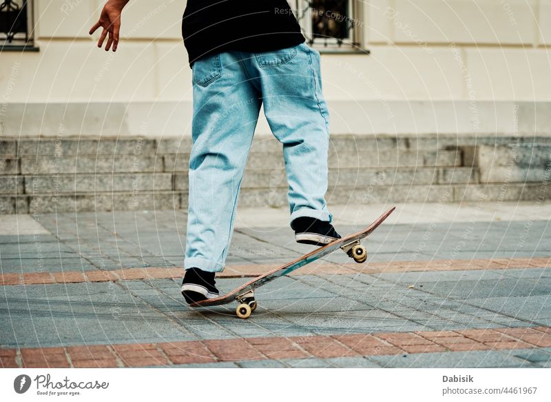 Skateboarder ride on skateboard at city street, close up skater sport boy hipster sneakers young shoes casual freestyle male streetwear action extreme fashion