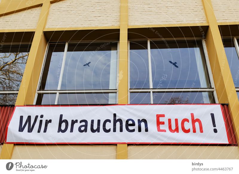 We need you ! Request for help on a banner on a house. Help Solidarity manifestation Company Attachment Humanity Characters Society Cry for help Facade Window