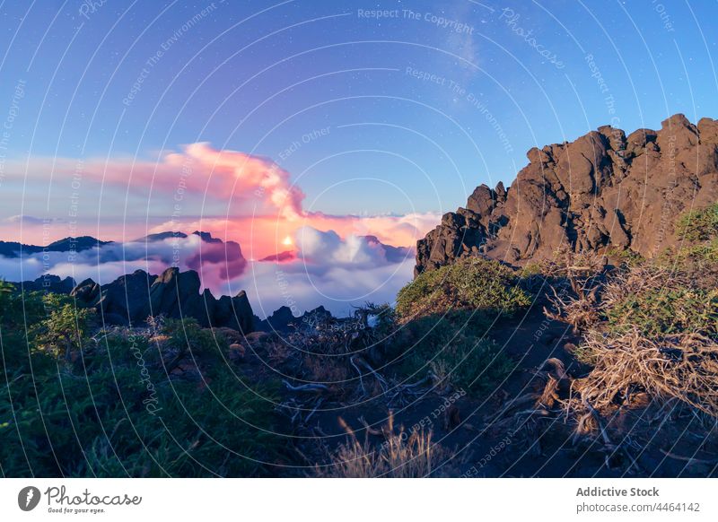 Peaks amidst clouds and volcano in the background milky way high peak nature outdoors sky travel landscape adventure astronomy exploration natural night