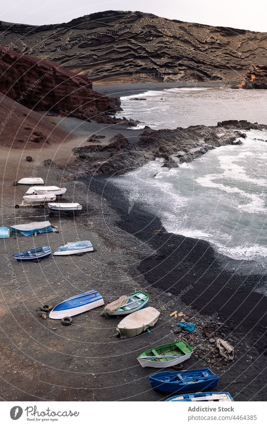 Natural Park of Volcanoes with boats on sea shore beach volcano nature highland landscape sky stormy island moor mountain foamy energy weather ripple water