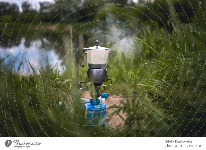 Making Coffee on Camping Gas in Nature cooking picnic making adventure morning coffee camping stove breakfast gas river nature making coffee coffee making