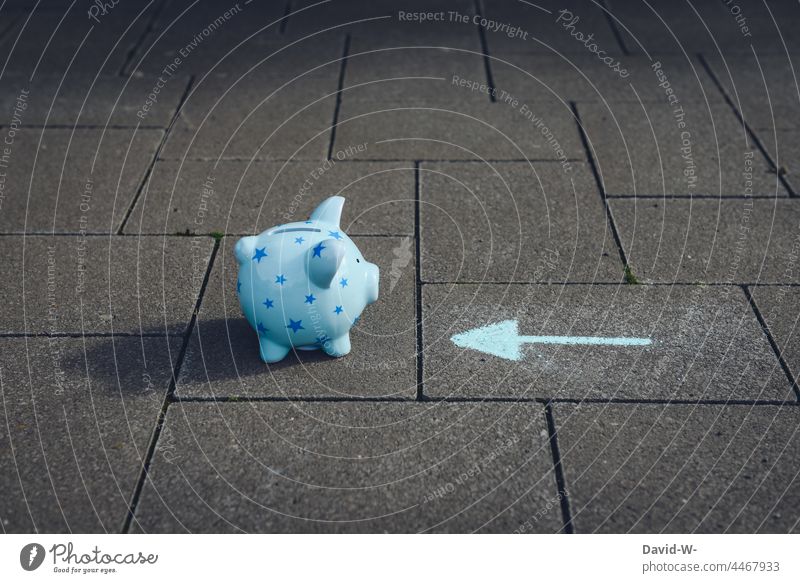 Saving - arrow points to a piggy bank Arrow Money box Save Debts Loose change reserves Poverty Interpret Indicate