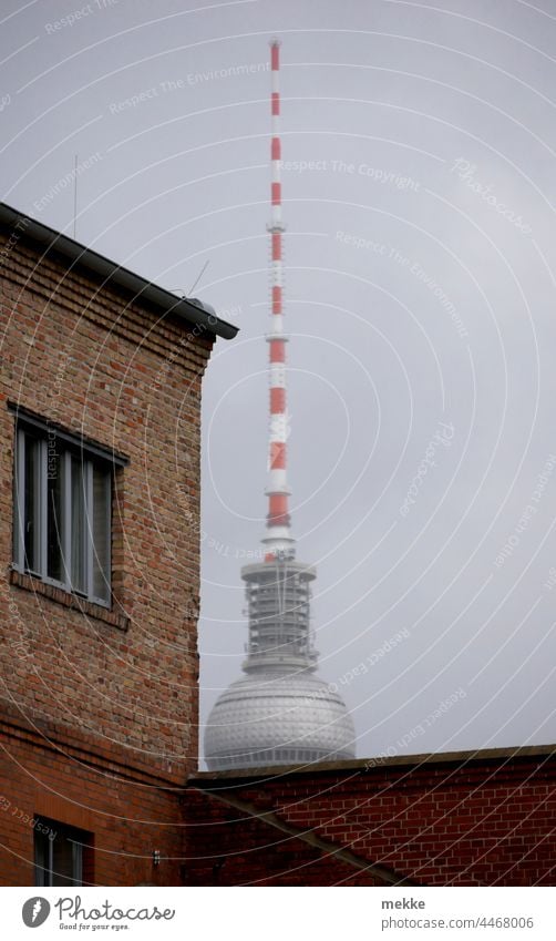 Television tower hides behind old clinker brick building Berlin TV Tower Alexanderplatz Landmark Capital city Tourist Attraction Downtown Architecture