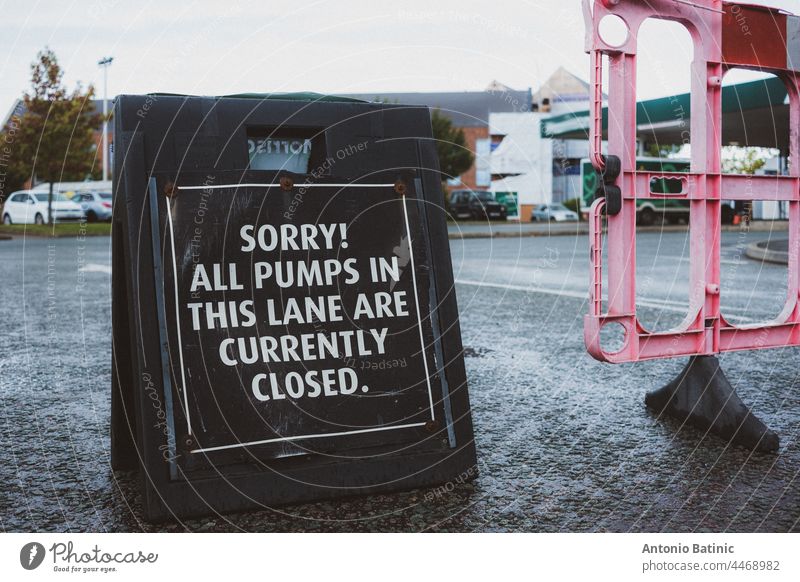 Black sign in front of a fuel station in England. Petrol crysis as there is fuel shortage in the country, people queueing up at petrol stations to get any fuel remaining