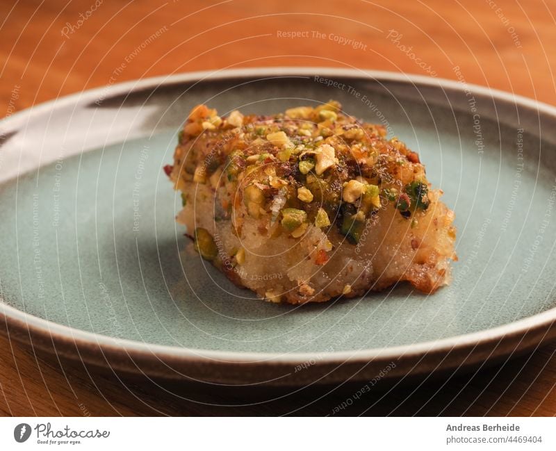 Syrian semolina cake with sugar syrup harisse closeup slice muslim selective focus sweet dessert pastry food cuisine lebanese plate snack tasty turkish