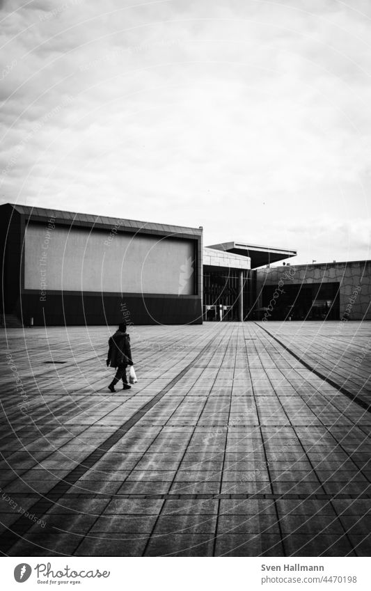 Man walks alone Architecture Building Modern architecture Facade Esthetic Symmetry Design Abstract Arrangement Line architectural photography Window