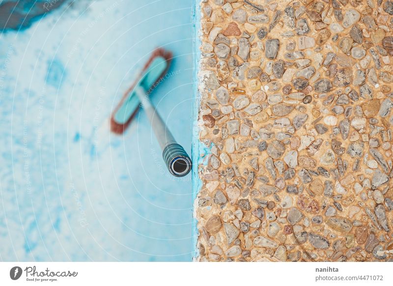 Background of a blue pool maintenance cleaning reform broom broomstick paint painting turquoise profesional damage damaged cracked swimming pool background