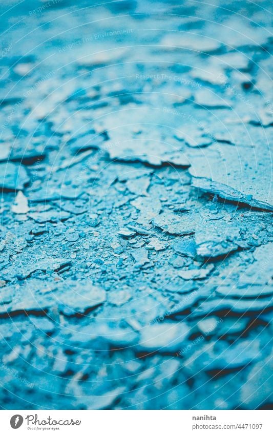 Abstract texture of cracked blue paint grunge rubble background abstract debris wreckage dry rough tones monochrome duotone cool cold freeze frozen break broken