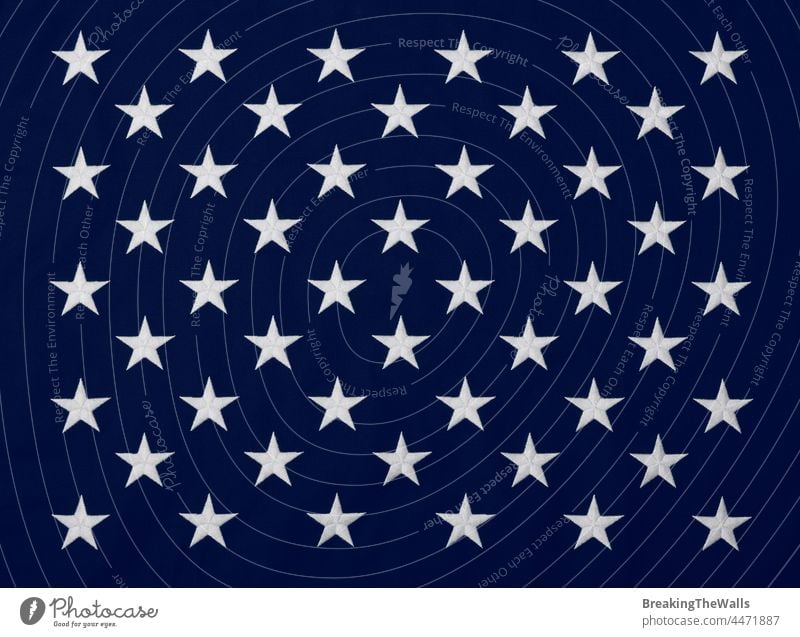 Embroidered stars of American flag blue canton Canton US USA United States white banner cotton canvas heavy background embroidered wave closeup full frame