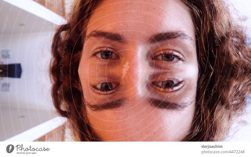 A portrait of an extraordinary photo, of a young pretty woman, where everything on her head is double. Looking Colour photo Nature Eyes Looking into the camera