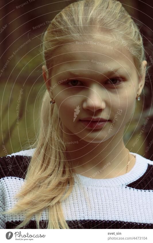 Portrait of a blonde girl in full face against the background of the autumn forest. portrait Autumn young outdoors looking teenager beauty natural hair lady