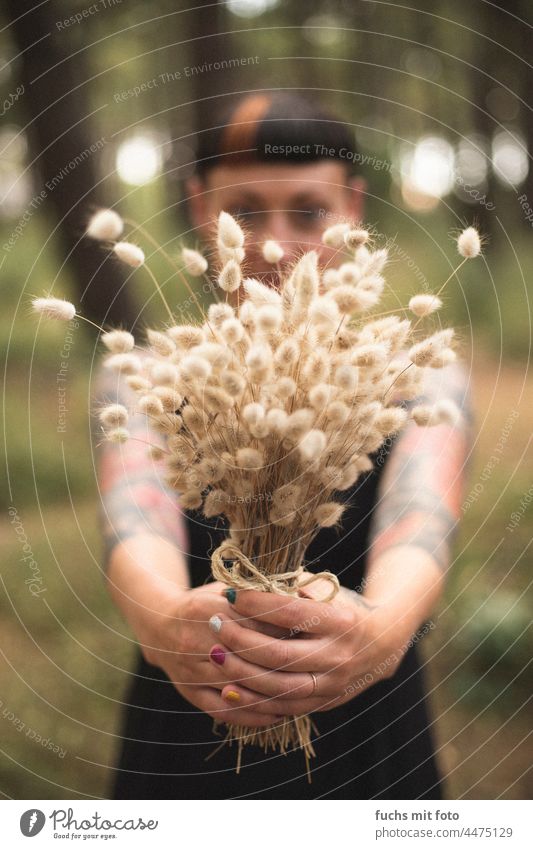 Young woman holding a bouquet, beach grass, Pampas grass Woman Tattooed Bangs fingernails variegated Ring Love pretty Colour photo Adults Body portrait Feminine