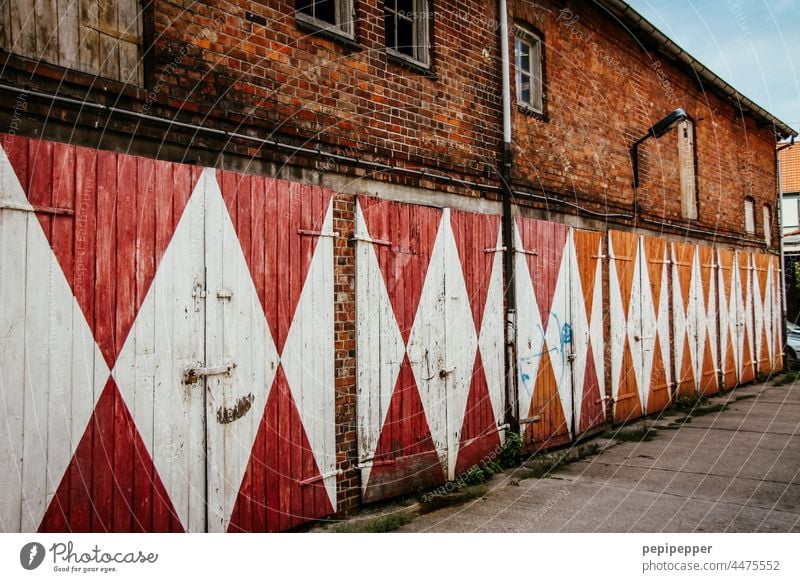 old garage doors Garage door garage entrance Garage doors garages Highway ramp (entrance) Goal Highway ramp (exit) Building Closed Facade Exterior shot Gloomy