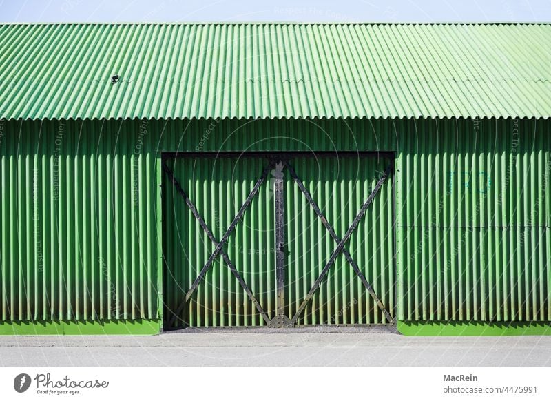 Green corrugated iron hall Manmade structures Architecture Hall Gate entrance nobody no man Exterior shot Corrugated sheet iron corrugated iron hut