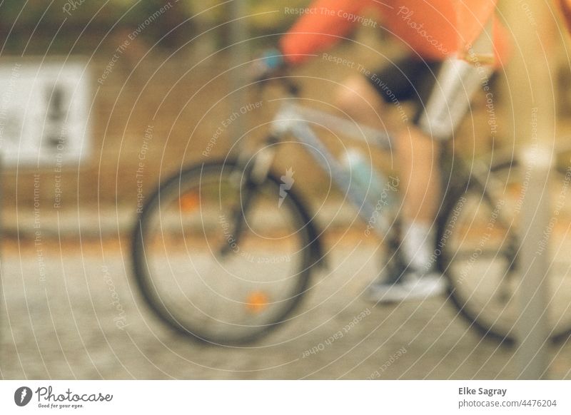 Bicyclist deliberately out of focus cycle blurriness Speed Colour photo Cycling Exterior shot motion blur Driving Street Asphalt Means of transport