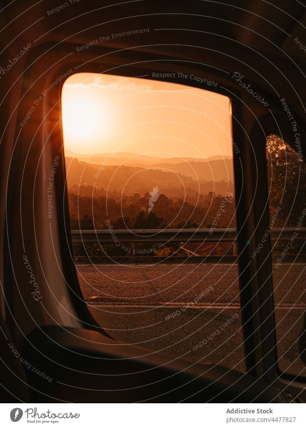 Sunset over mountains through car window sunset scenery sundown highland landscape road vehicle galicia spain nature dusk transport picturesque breathtaking