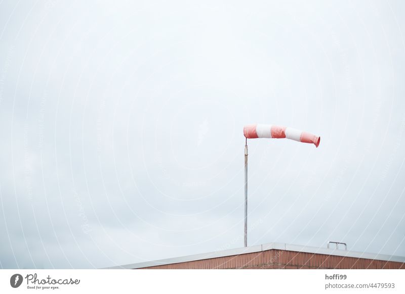 filled windsock - it blows hard from the west Windsock West West wind Autumn Autumn storms Gale Red Sky Clouds Weather Nature Air speed meter Gray Landscape