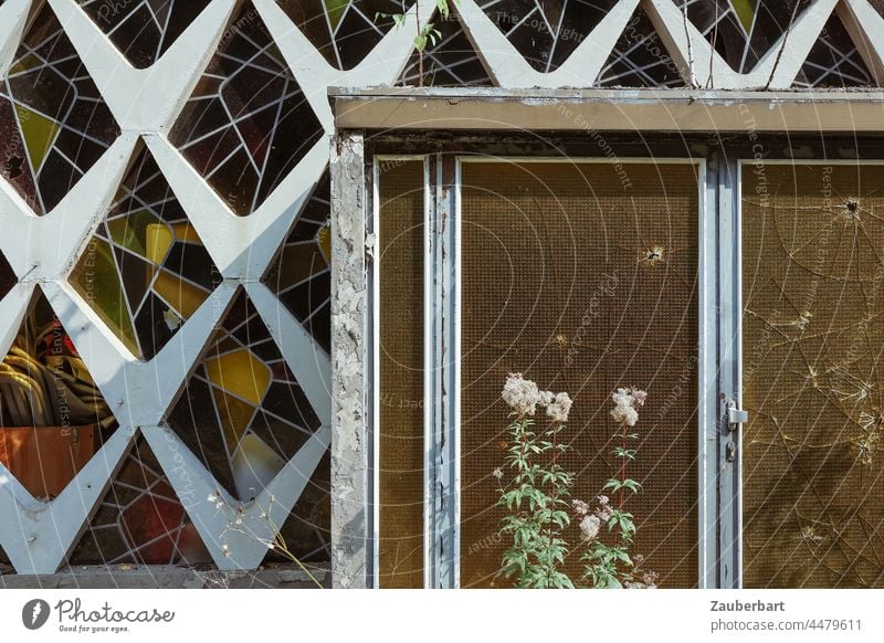 Entrance door and facade with stained glass, architecture of the 60s, dilapidated, Front door Stained glass Facade '60s Architecture Derelict Pattern