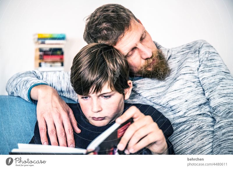 favorite activities Education observantly proximity Cuddling portrait Contrast Light Colour photo Interior shot Day Son Interest Curiosity Love Warm-heartedness