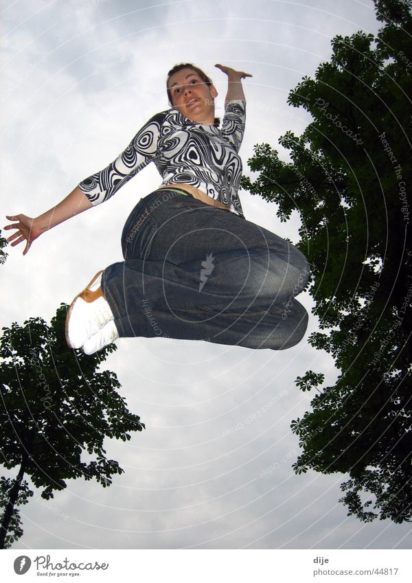 The elegant jump Jump Night Clouds Tree Woman Practice Sky Blue Jeans Movement