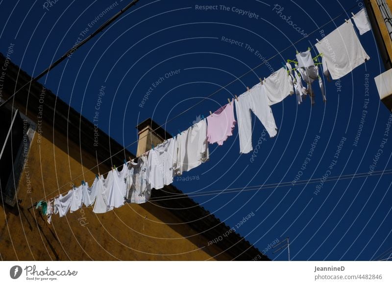 Clothesline full of white laundry from house to house Venice Laundry clothesline Clothes peg Household Washing Housekeeping Clothing Hang Fresh everyday life