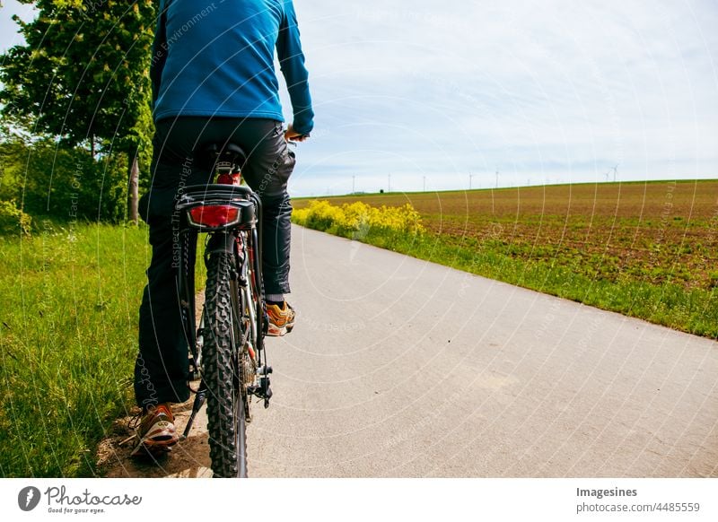 Bike ride. Male cyclist on a bicycle path. bike tour masculine cyclists Bicycle people Adults Street healthy lifestyle Lifestyles recreational activities