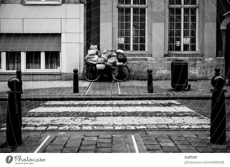 a bicycle with belongings - all that remains Life on the street Homelessness packed burden homeless person outcast Deprived area social relegation Descent