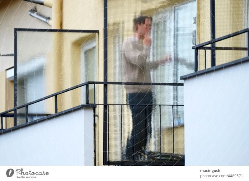 Anonymous balcony smoker Balcony Exterior shot Smoking Smoky Cigarette Human being Only one man more adult Smoke Cigarette smoke Addiction Nicotine