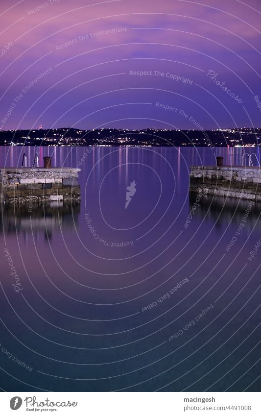 Sunset after thunderstorm at the sea Mole pier Ocean blue hour Evening Water Surface of water Long exposure Deserted Twilight Exterior shot coast Horizon