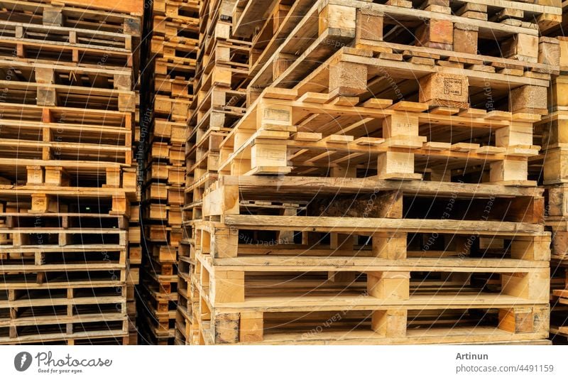 Stack of wooden pallet. Industrial wood pallet at factory warehouse. Cargo and shipping concept. Sustainability of supply chains. Eco-friendly nature and sustainable properties. Renewable wood pallet.