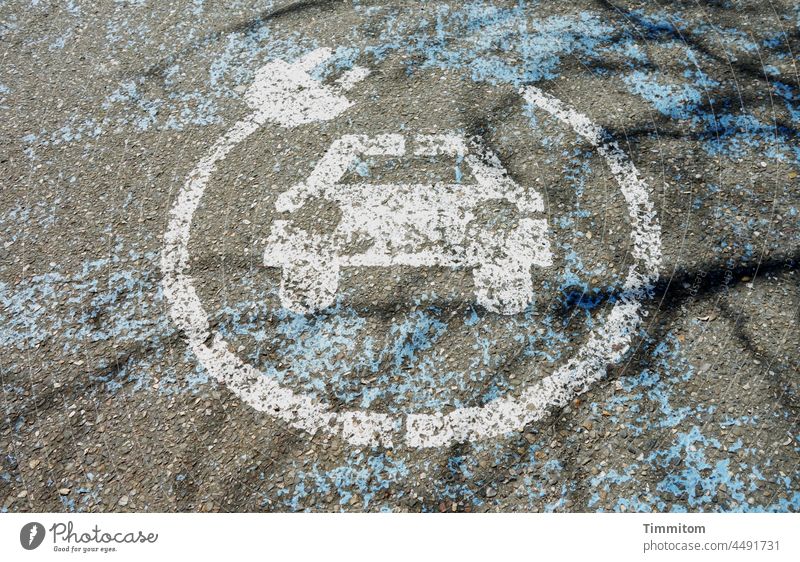 Strained mark e-car charging station Clue Pictogram Asphalt Street Transport eMobility Electric Vehicle Exterior shot Means of transport Deserted symbol