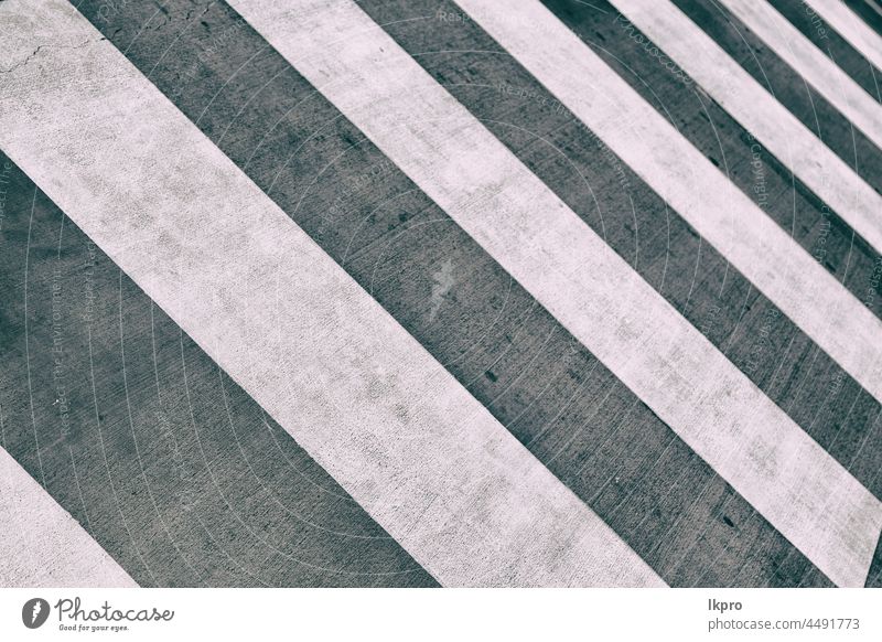 the concept of safety  whit  zebra crossing crosswalk pedestrian road street asphalt traffic sidewalk sign city abstract white line urban walkway texture