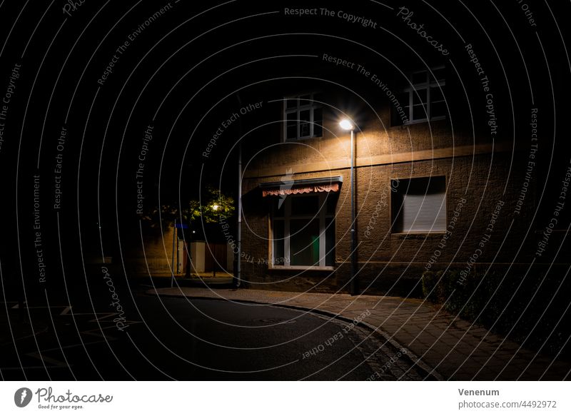 Old house with a street lamp at night in the town of Luckenwalde in Germany streets Building buildings germany teltow flaeming pavement sidewalk footpath