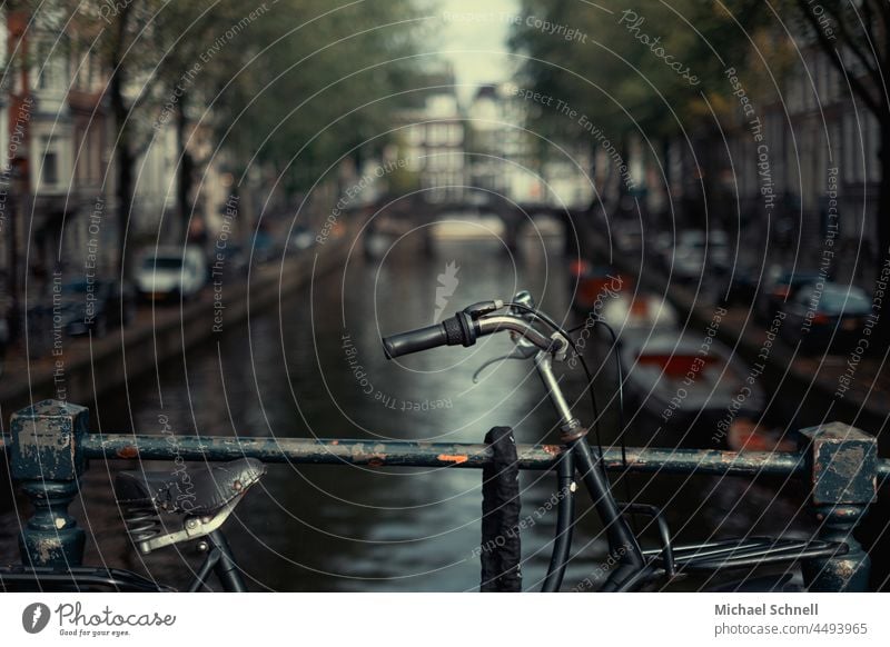 Bicycle in front of a canal in Amsterdam Cycling Movement Leisure and hobbies Colour photo Transport Driving Mobility Gracht boats Boating trip Body of water