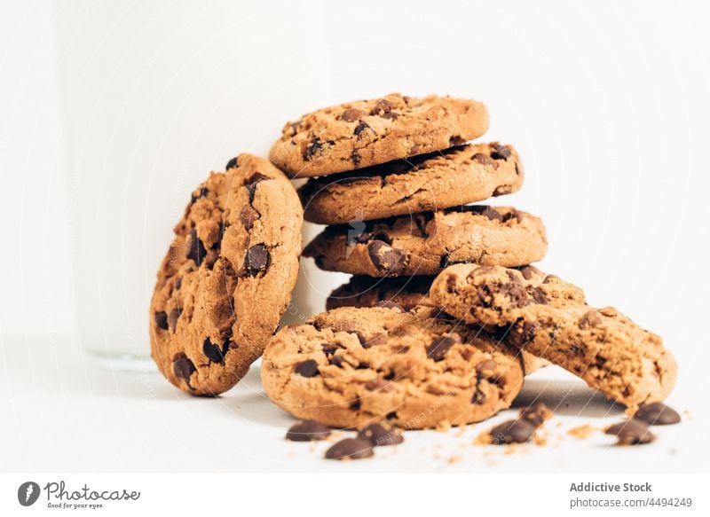 Tasty chocolate chip cookies on table dessert sweet pastry baked biscuit milk dairy treat drop tasty delicious snack pile calorie sugar yummy heap crumb